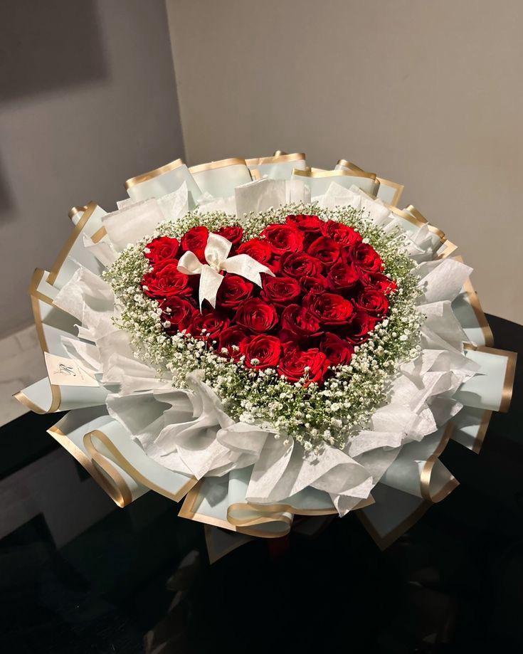 Heart of Roses 30 red roses arranged in heart shape with gold trimmed wrap
