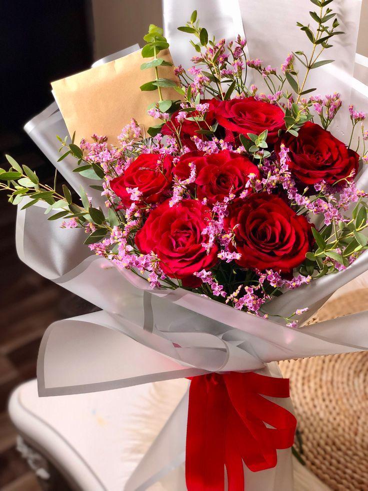 Onyx and Rose crimson red roses in signature black gold embossed wrap