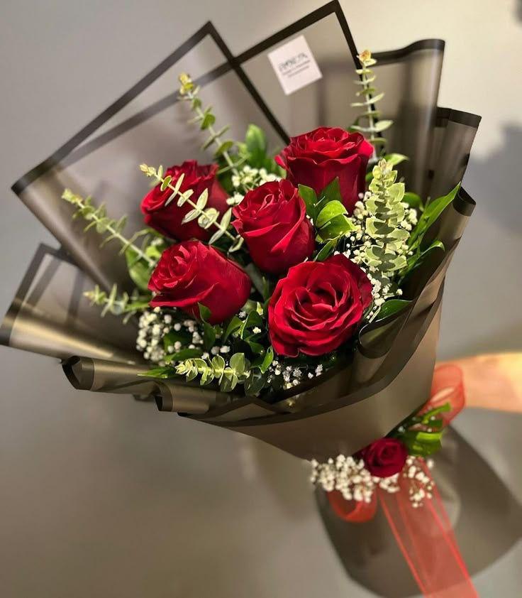 Midnight Velvet classic red roses wrapped in black mesh ribbon Ooty