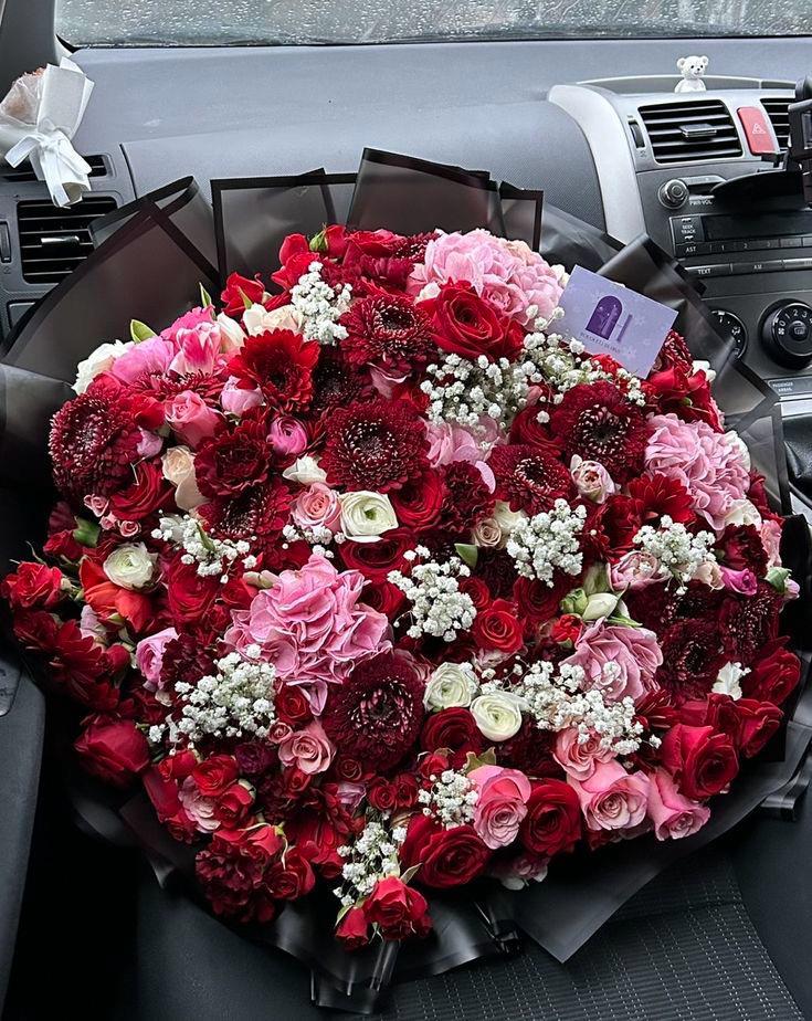 Grand Crimson Affair oversized red roses and velvet dahlias in noir wrap