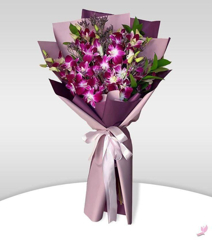 Orchid Violet purple dendrobium orchids in lavender wrapping Ooty