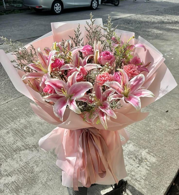 Stargazer Serenade pink stargazer lilies and carnations in blush wrap