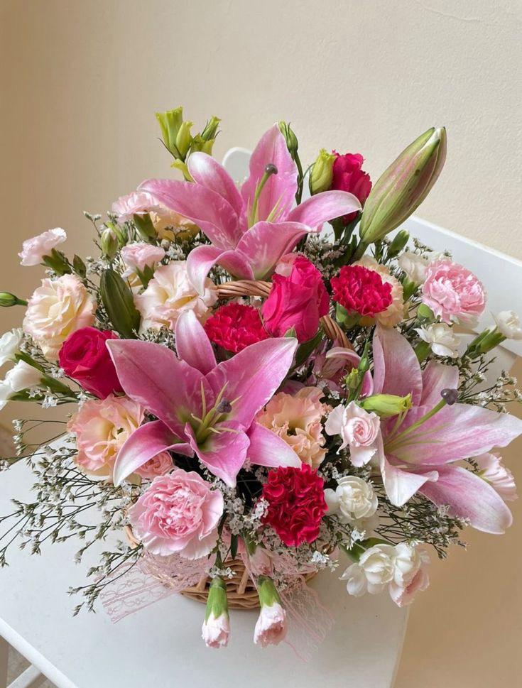 Lily Basket Bouquet wicker basket floral arrangement in Ooty